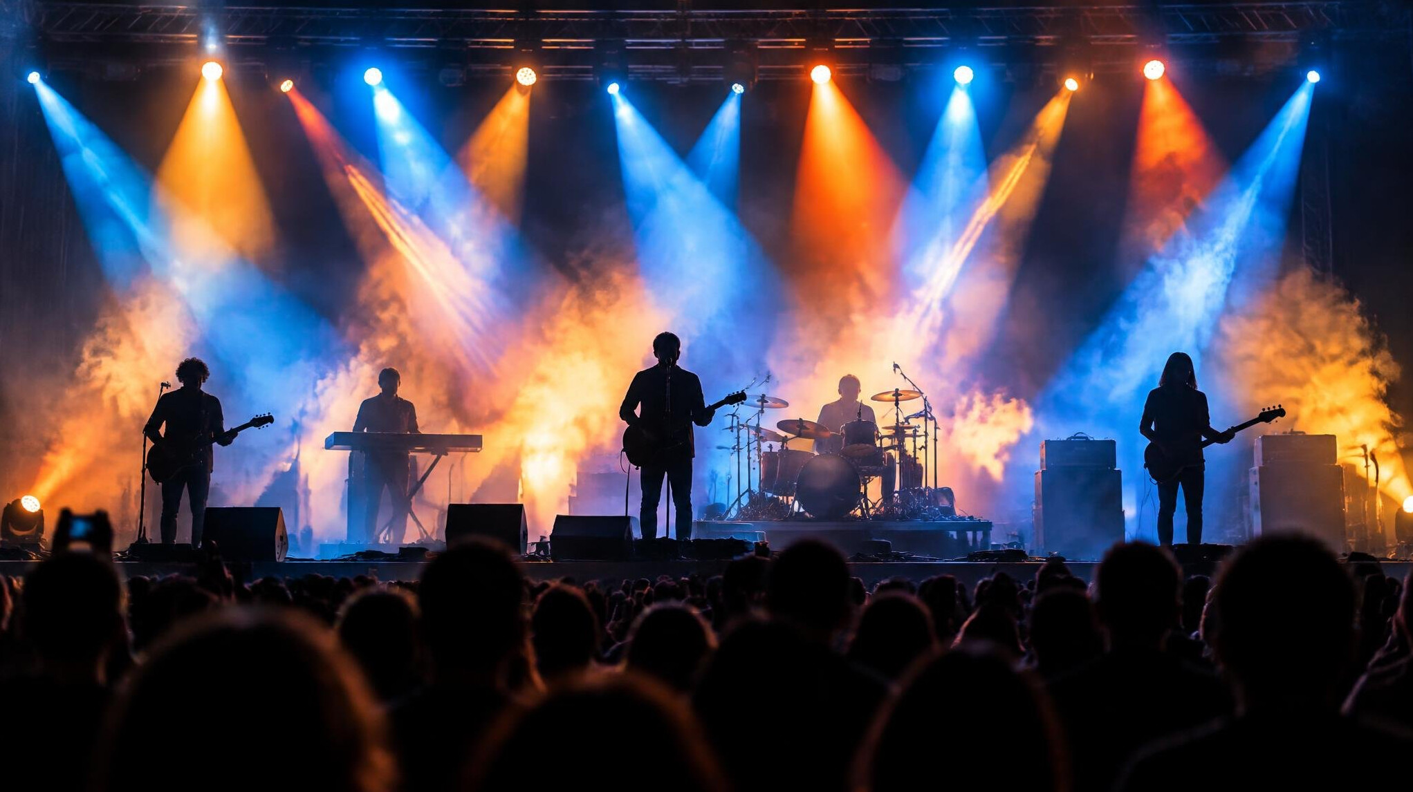 Concert stage with colorful lights and silhouettes